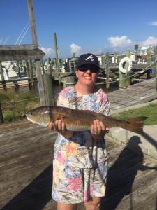 a person holding a fish